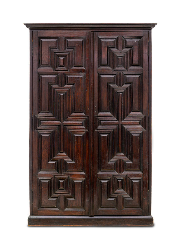 Closed rectagular cabinet made from a dark wood. Photographed on a white background.